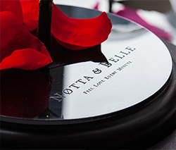 Branded inscription Notta & Belle on the base for rose in glass.
